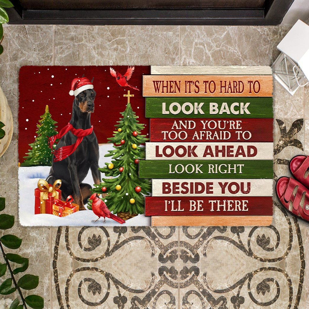 Christmas Doberman 2 Look right beside you Doormat